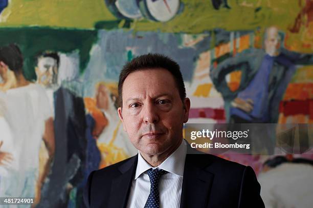 Yannis Stournaras, Greece's finance minister, poses for a photograph following a Bloomberg Television interview at the Ministry of Finance offices in...