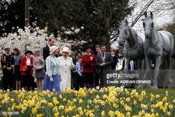 Britain's Queen Elizabeth II joined by Britain's Prince Philip, Duke of Edinburgh and Britain's Prince William, Duke of Cambridge, officially unveils...