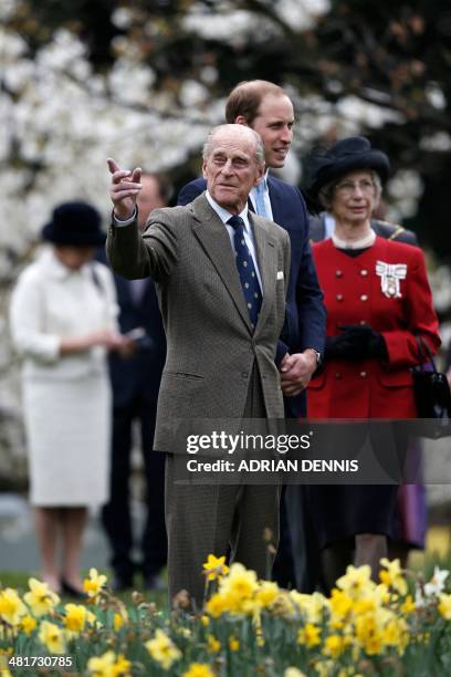 Britain's Prince Philip, Duke of Edinburgh and Britain's Prince William, Duke of Cambridge accompany Britain's Queen Elizabeth II to officially...