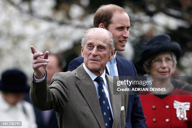 Britain's Prince Philip, Duke of Edinburgh and Britain's Prince William, Duke of Cambridge accompany Britain's Queen Elizabeth II to officially...