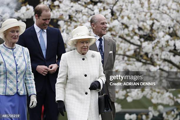 Britain's Queen Elizabeth II joined by Britain's Prince Philip, Duke of Edinburgh and Britain's Prince William, Duke of Cambridge arrives to...