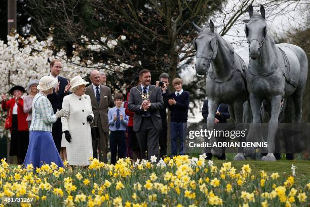 Britain's Queen Elizabeth II joined by Britain's Prince Philip, Duke of Edinburgh and Britain's Prince William, Duke of Cambridge arrives to...