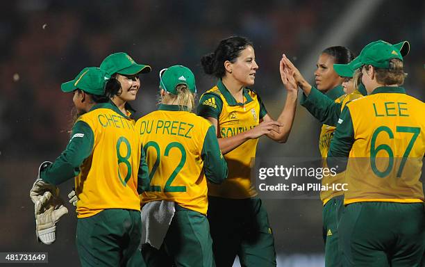 MariZanne Kapp of South Africa celebrates the wicket of Sophie Devine of New Zealand during the ICC Women's World Twenty20 match between New Zealand...