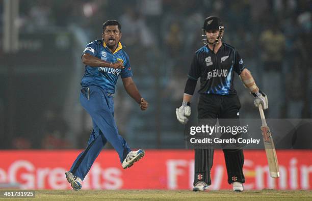 Rangana Herath of Sri Lanka celebrates dismissing Luke Ronchi of New Zealand during the ICC World Twenty20 Bangladesh 2014 Group 1 match between Sri...