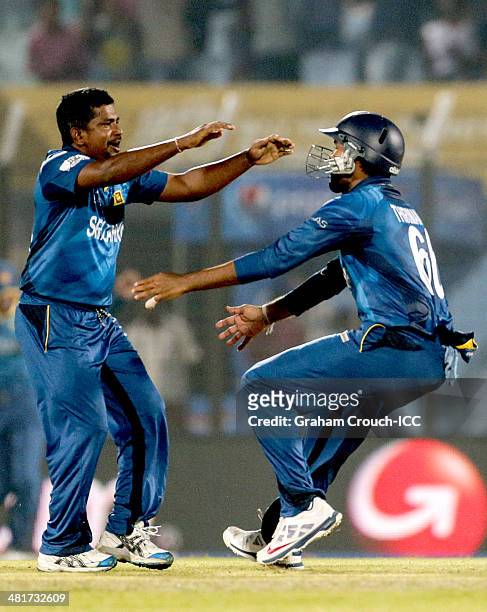 Rangana Herath of Sri Lanka celebrate a wicket during the Sri Lanka v New Zealand match at the ICC World Twenty20 Bangladesh 2014 played at Zahur...