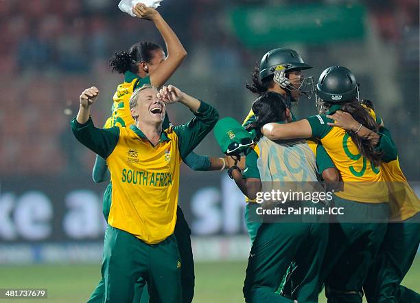 Mignon Du Preez captain of South Africa celebrates with teammates after winning the ICC Women's World Twenty20 match between New Zealand Women and...