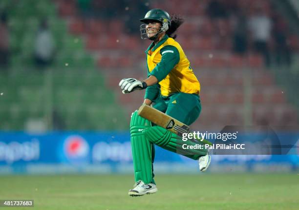 Chloe Tryon of South Africa runs to celebrate after hitting the winning run during the ICC Women's World Twenty20 match between New Zealand Women and...