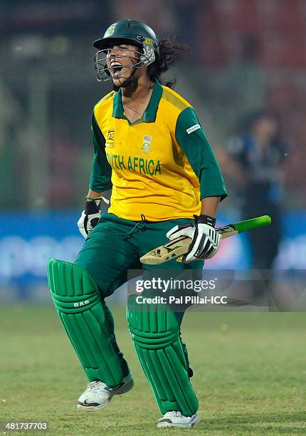Chloe Tryon of South Africa runs to celebrate after hitting the winning run during the ICC Women's World Twenty20 match between New Zealand Women and...