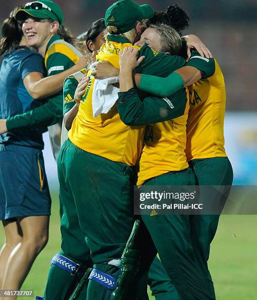 Mignon Du Preez captain of South Africa celebrates with teammates after winning the ICC Women's World Twenty20 match between New Zealand Women and...