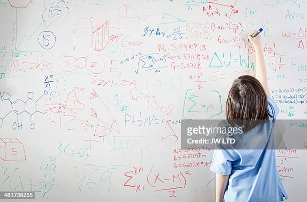 schoolgirl in front of wipe board, math equations - mathematics stock pictures, royalty-free photos & images