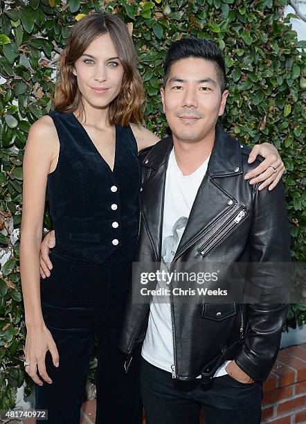 Alexa Chung and Samuel Ku, president and creative director of AG attend the launch of Alexa Chung X AG PA at Ron Herman on July 23, 2015 in Los...