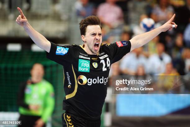 Patrick Groetzki of Rhein-Neckar Loewen celebrates a goal during the Velux EHF Champions League Round of 16 second leg match between Rhein-Neckar...