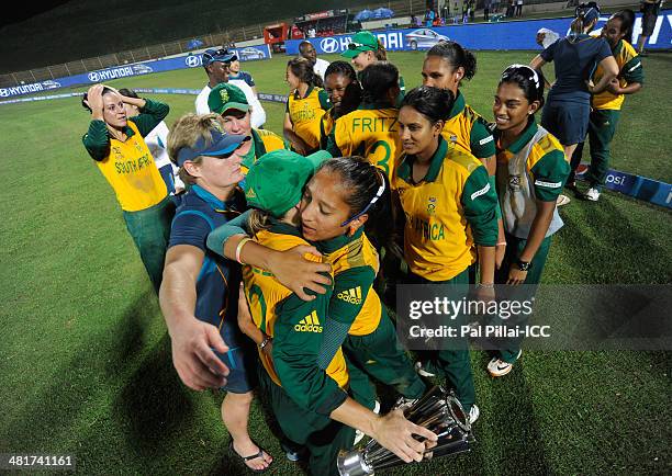 Mignon Du Preez captain of South Africa is congratulated by teammates after she receives the player of the match award during the presentation after...