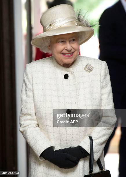 Britain's Queen Elizabeth II arrives to officially unveil the Windsor Greys statue in Windsor on March 31, 2014. The statue marks 60 years of the...