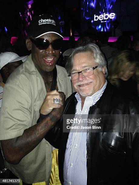 Former NBA player Dennis Rodman and Miami Heat owner Micky Arison pose circa March 2014 in Miami Florida.