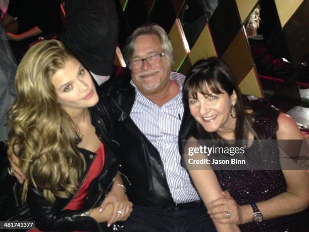 Model Nina Agdal, Miami Heat owner Micky Arison and his wife Madeleine Arison pose circa March 2014 in Miami Florida.