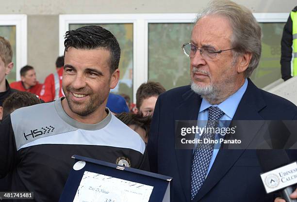 Antonio Di Natale of Udinese Calcio receives a plaque from Gianpaolo Pozzo president of Udinese Calcio before the Serie A match between Udinese...