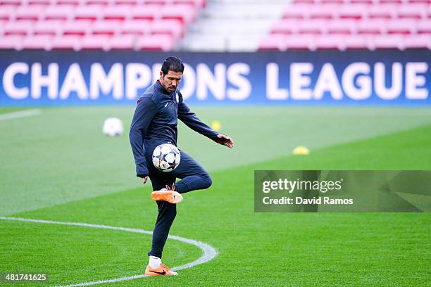 Head coach Diego Pablo Simeone of Club Atletico de Madrid juggles sthe ball during a training session ahead the UEFA Champions League Quarter Final...