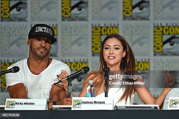 Actor Ricky Whittle and actress Lindsey Morgan attend a special video presentation and panel for "The 100" during Comic-Con International 2015 at the...