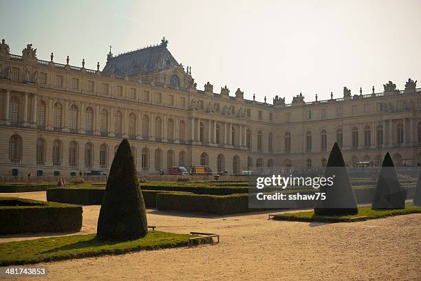 back lit palace of versailles - versailles stock pictures, royalty-free photos & images