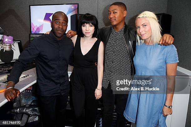 Singer Carly Rae Jepson poses for pictures with Melvin Odoom, Rickie Haywood Williams and Charlie Hedges during a visit to the Kiss FM Studios on...