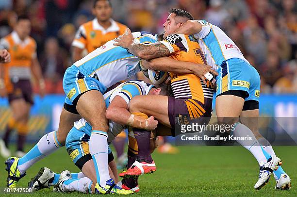 Corey Parker of the Broncos attempts to break free from the defence during the round 20 NRL match between the Brisbane Broncos and the Gold Coast...