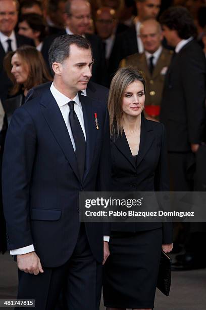 Prince Felipe of Spain and Princess Letizia of Spain leave from the state funeral for former Spanish prime minister Adolfo Suarez at the Almudena...