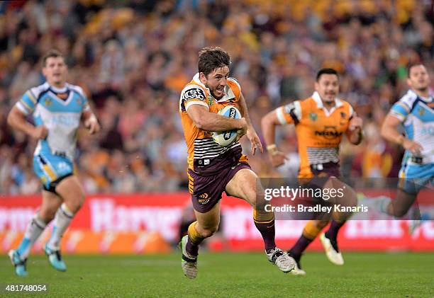 Ben Hunt of the Broncos breaks away from the defence during the round 20 NRL match between the Brisbane Broncos and the Gold Coast Titans at Suncorp...