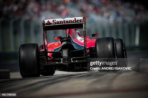 Ferrari's Finnish driver Kimi Raikkonen drives out of the pits during the first practice session of the Hungarian Grand Prix Formula One race on July...