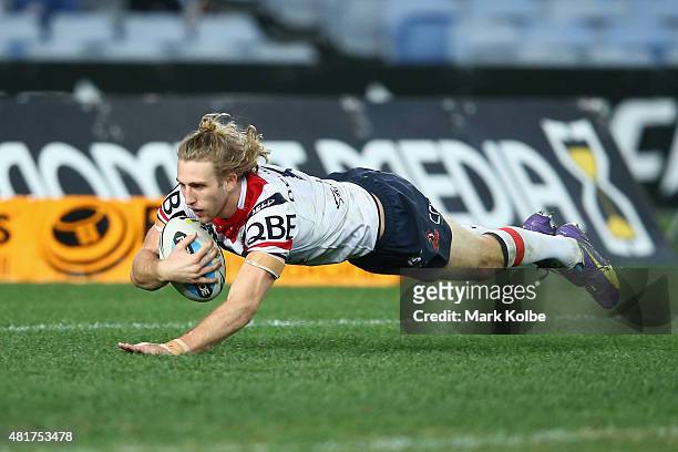Brendan Elliot of the Roosters scores a try during the round 20 NRL match between the Wests Tigers and the Sydney Roosters at ANZ Stadium on July 24,...