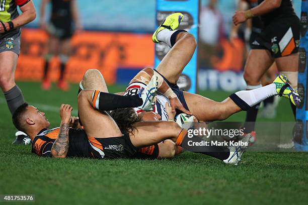 Sam Moa of the Roosters scores a try during the round 20 NRL match between the Wests Tigers and the Sydney Roosters at ANZ Stadium on July 24, 2015...