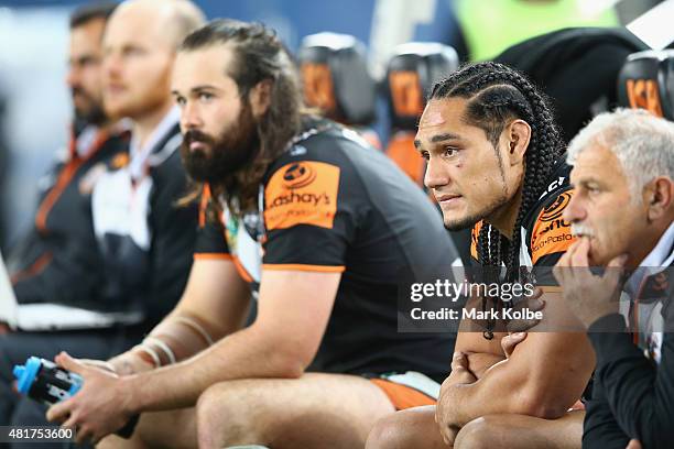 Aaron Woods and Martin Taupau of the Wests Tigers watch on from the bench during the round 20 NRL match between the Wests Tigers and the Sydney...