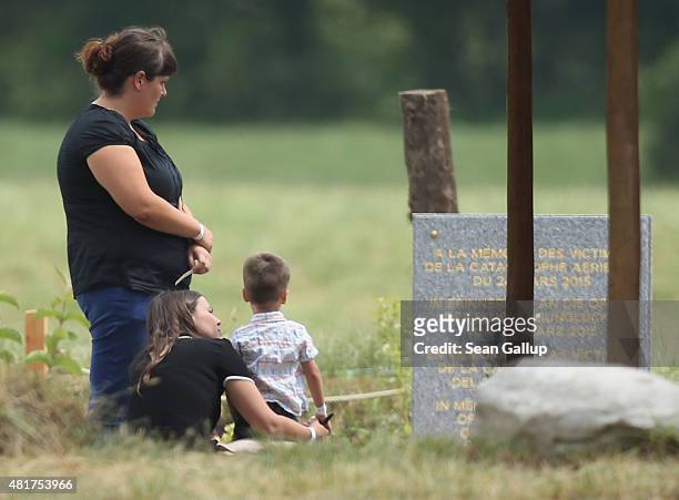Family members of the Germanwings flight 4U9525 crash victims stand at a memorial to the victims prior to a memorial ceremony for the last victims on...
