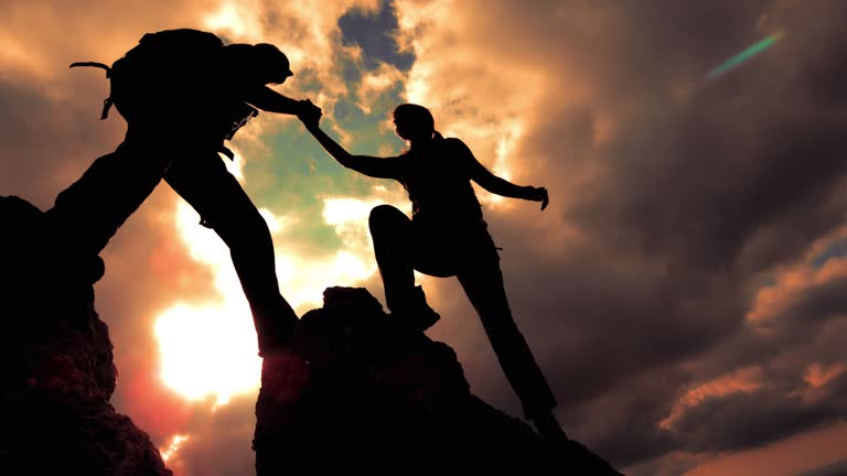 https://media.gettyimages.com/id/481754074/video/silhouette-of-a-couple-reaching-the-top-together.jpg?b=1&s=640x640&k=20&c=iBlLze1r522Plv42GTeEofNWA0aMiiPWT9QIOm-uBnE=