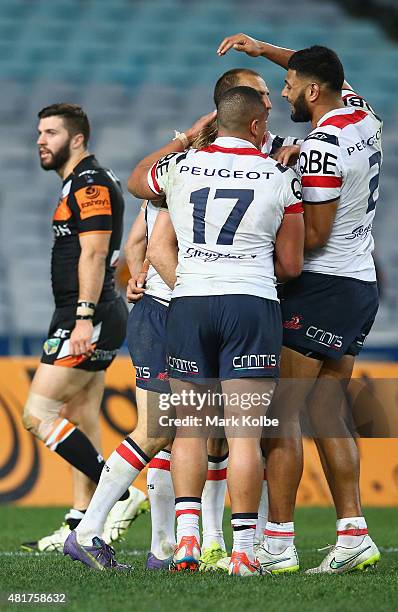 Brendan Elliot of the Roosters celebrate with is team after scoring a try during the round 20 NRL match between the Wests Tigers and the Sydney...