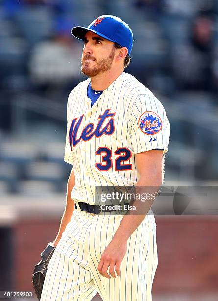 John Lannan of the New York Mets walks off the field after the top of the 10th inning against the Washington Nationals during Opening Day on March...