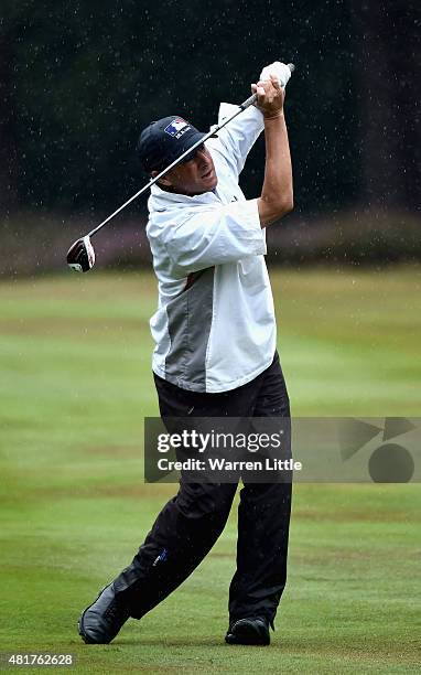 Billy Andrade of the USA plays his second shot into the 12th green during the second round of The Senior Open Championship on the Old Course at...