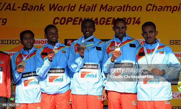 Team Eritrea of Samuel Tsegay, Zersenay Tadese, Nguse Amlosom, Ghirmay Ghebreslassie and Samson Gebreyohannes celebrate with their gold medal during...