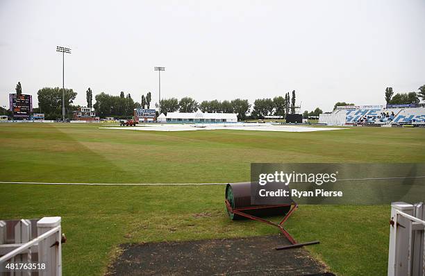 General view of covers on the pitch after rain stopped play during day two of the Tour Match between Derbyshire and Australia at The 3aaa County...