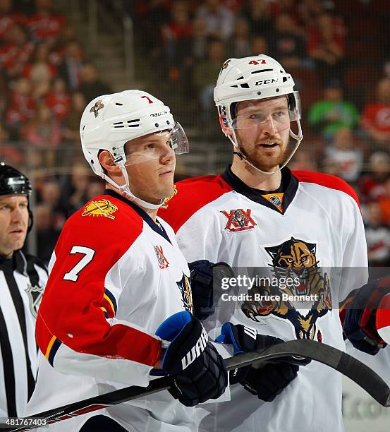 Dmitry Kulikov of the Florida Panthers celebrates his shorthanded goal at 17:22 of the first period along with Colby Robak against the New Jersey...