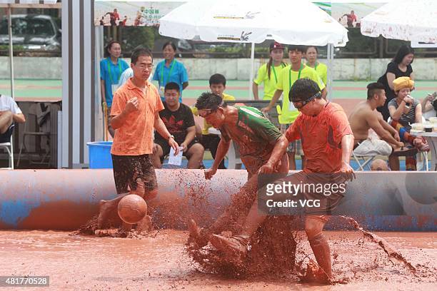 Players compete for the ball during a game of 2015 Swamp Soccer China at Yuetan gymnasium on July 24, 2015 in Beijing, China. The 2015 Swamp Soccer...