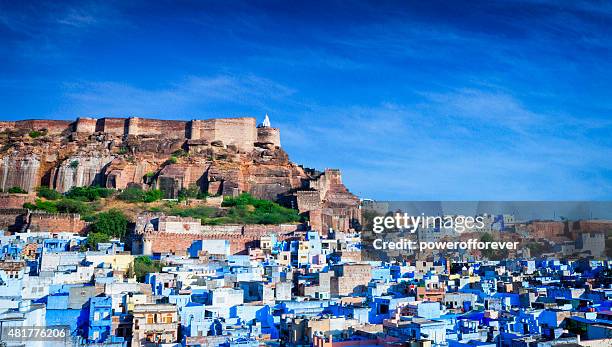 cityscape of blue city and mehrangarh fort - jodhpur, india - indian fort stock pictures, royalty-free photos & images