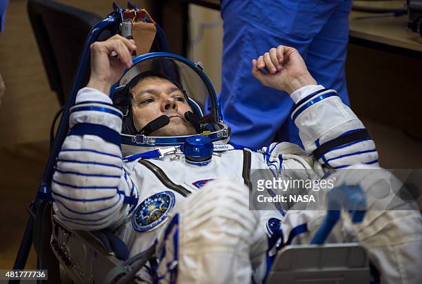 Expedition 44 Soyuz Commander Oleg Kononenko of the Russian Federal Space Agency has his Russian Sokol suit pressure checked in preparation for...