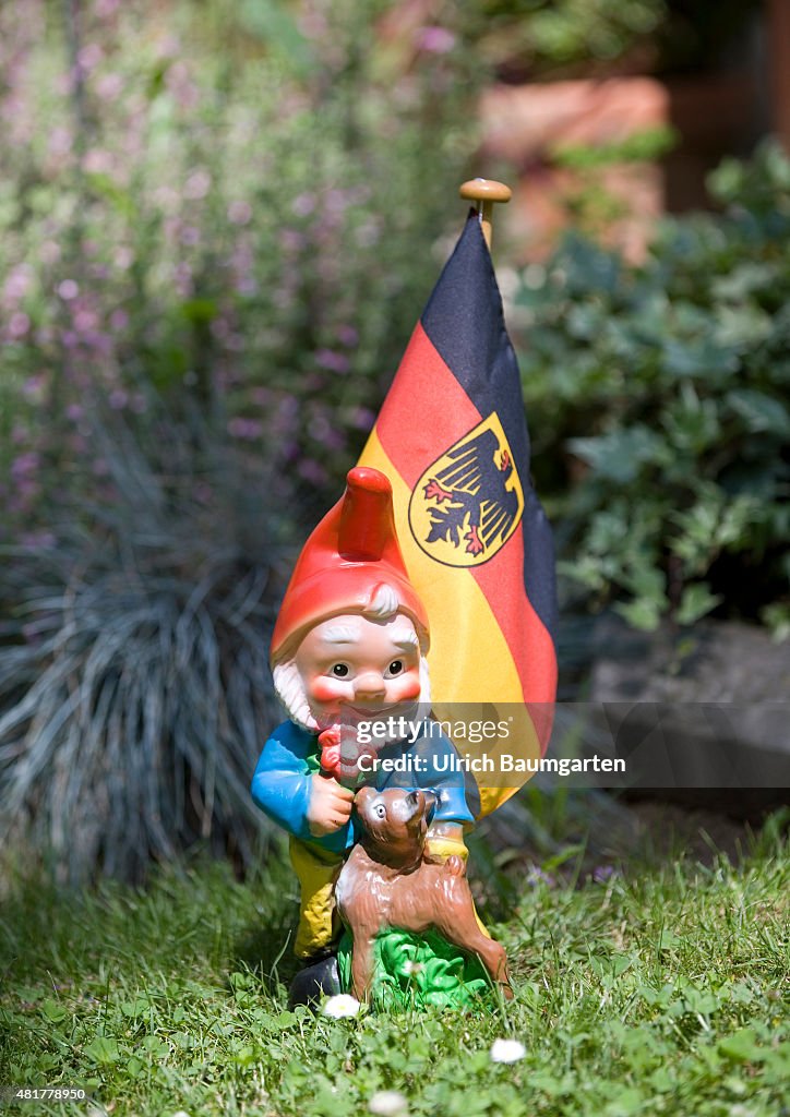 Garden gnome with a German flag.