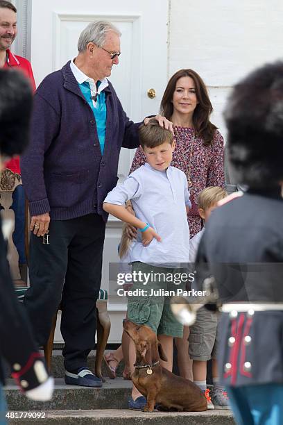Prince Henrik of Denmark, Crown Princess Mary of Denmark, and Prince Christian of Denmark view The Guard Change At Grasten Castle on July 24, 2015 in...