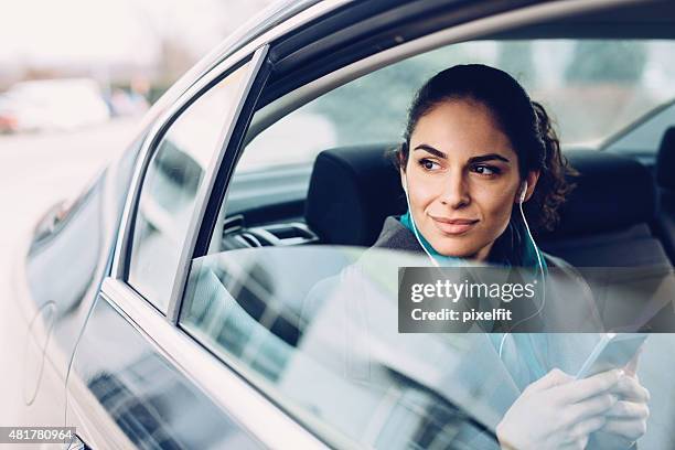 businesswoman in car - music from the motor city stock pictures, royalty-free photos & images