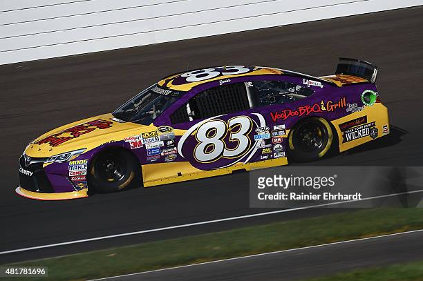 Matt DiBenedetto, driver of the VooDoo BBQ & Grill Toyota, practices for the NASCAR Sprint Cup Series Crown Royal Presents the Jeff Kyle 400 at the...