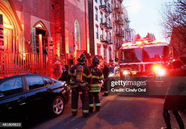 Members of the New York City Fire Department are seen assisting in an