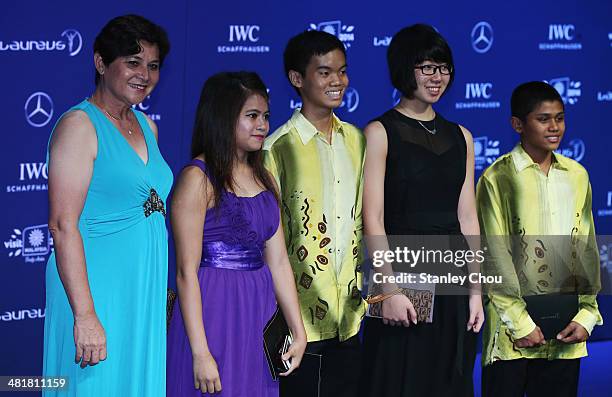 Datuk Marina Chin, principal of the Bukit Jalil Sports School with the Malaysian Sportsboys and Sportsgirls of 2012 and 2013 attend the 2014 Laureus...