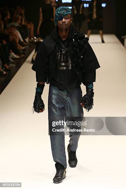 Model, wearing an outfit by the label La Folie, walks the runway at the AMD Akademie Mode & Design Best Graduate Show during Platform Fashion July...